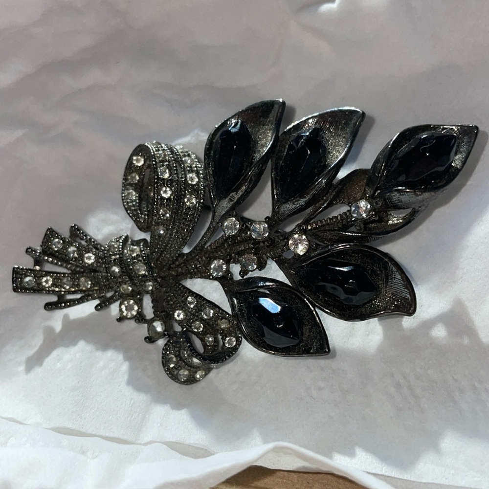 Flower brooch with black gems